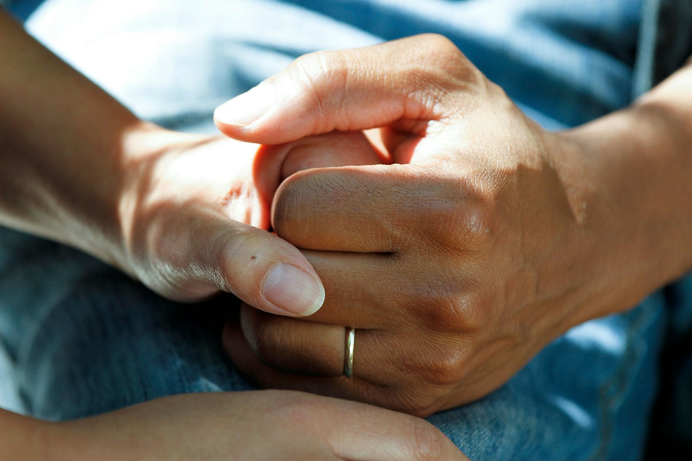 A professional caregiver talking with an older adult at home